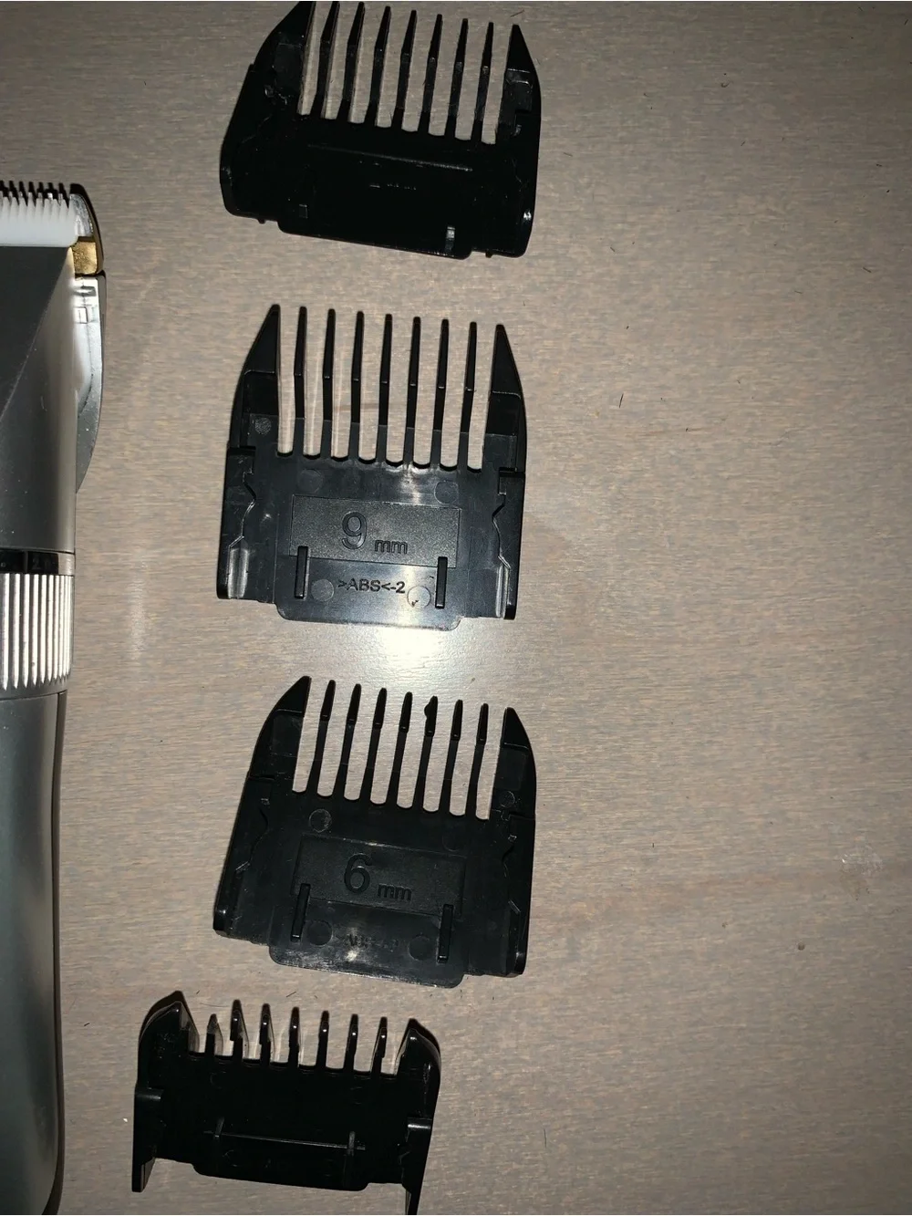Silver Rechargeable Men's Hair Trimmer with 4 Guide Combs